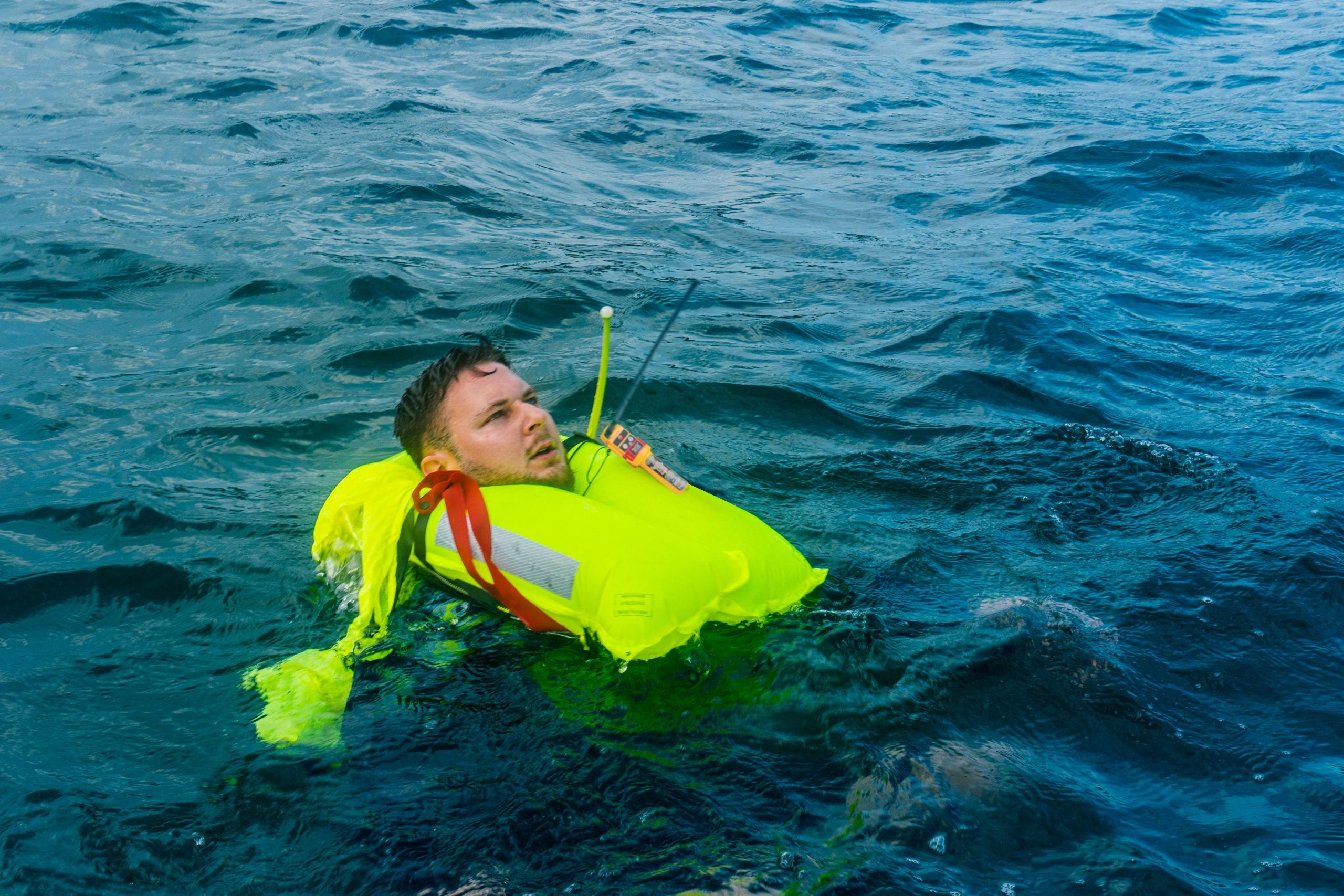 Collection of Person in the water wearing an inflated lifejacket with a deployed Ocean Signal RescueME MOB2 in a gallery layout