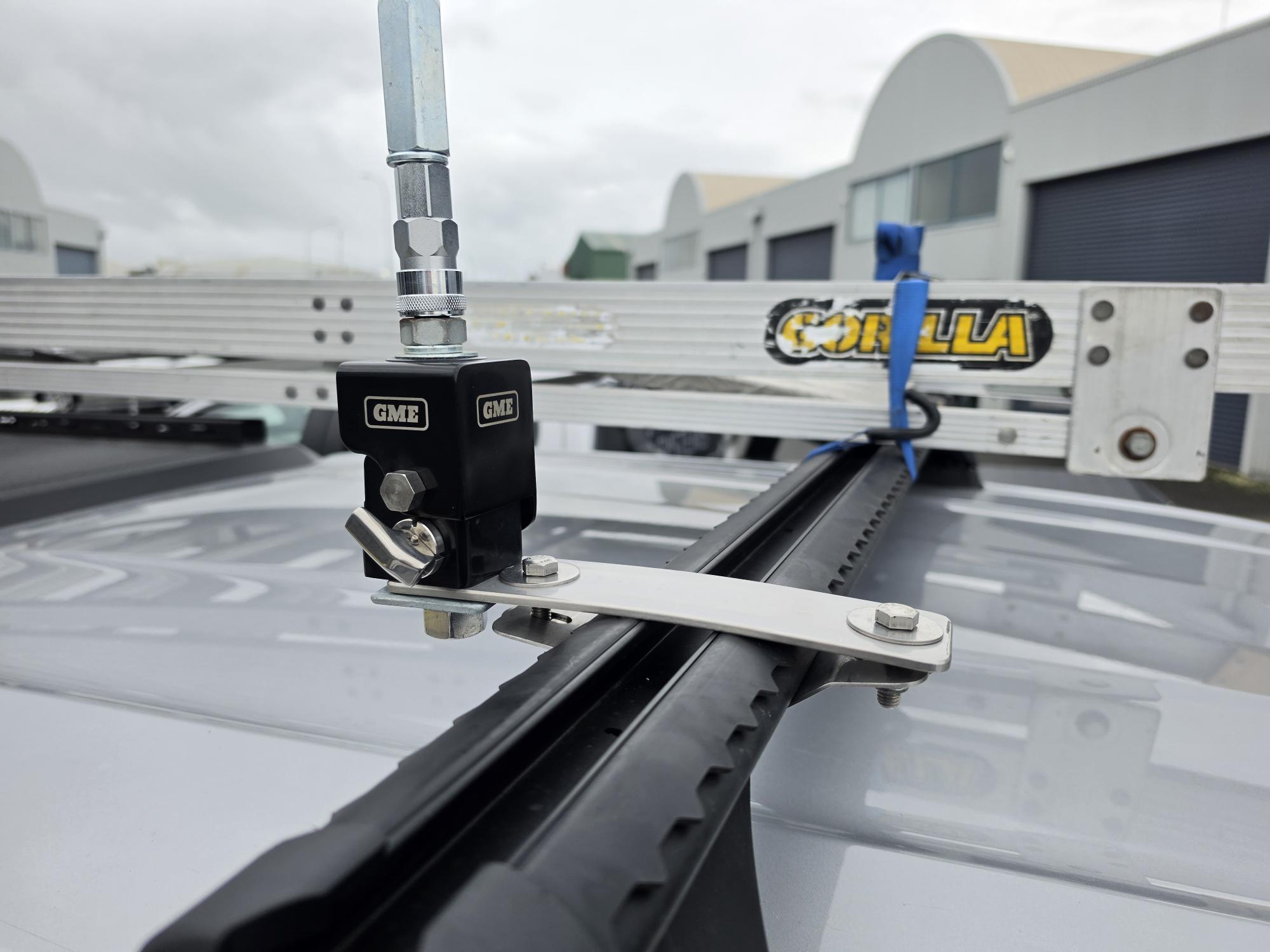 Collection of Close-up of a GME roof rack mounting system attached to a vehicle roof in a gallery layout